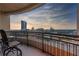 Private balcony with chairs and table offers stunning views of the city skyline at 3445 Stratford Ne Rd # 3601, Atlanta, GA 30326