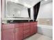 Spacious bathroom featuring a double vanity, large mirror, and bathtub at 3445 Stratford Ne Rd # 3601, Atlanta, GA 30326