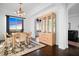 Cozy dining room with a chandelier, hardwood floors, a wooden table set, and a cabinet for elegant dinners at 3445 Stratford Ne Rd # 3601, Atlanta, GA 30326