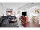 Inviting living room featuring dark wood floors open to kitchen and dining area at 3445 Stratford Ne Rd # 3601, Atlanta, GA 30326