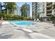 Outdoor swimming pool with plenty of lounge chairs and surrounding high rise buildings at 3445 Stratford Ne Rd # 3601, Atlanta, GA 30326
