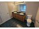 Bathroom featuring double sink vanity with granite countertops, offering a functional and elegant space at 215 Moseley Crossing Dr, Stockbridge, GA 30281