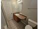 Cozy bathroom with a sink, mirror, toilet, and a tile floor at 215 Moseley Crossing Dr, Stockbridge, GA 30281