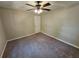 Neutral bedroom features carpet, a ceiling fan, and single-door closet at 215 Moseley Crossing Dr, Stockbridge, GA 30281