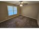 Bedroom with neutral walls, carpet, and a window at 215 Moseley Crossing Dr, Stockbridge, GA 30281