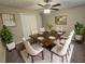 Formal dining room featuring a large table set for eight and modern decor at 215 Moseley Crossing Dr, Stockbridge, GA 30281