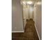 Neutral colored hallway with various doors and tile flooring at 215 Moseley Crossing Dr, Stockbridge, GA 30281