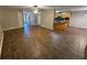 Open floor plan with tile flooring connecting the kitchen to the dining area at 215 Moseley Crossing Dr, Stockbridge, GA 30281