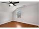 Bright bedroom featuring hardwood floors and ceiling fan at 105 Dockstreet Aly, Peachtree City, GA 30269