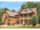 Brick house with balcony, and stone accents at 105 Dockstreet Aly, Peachtree City, GA 30269