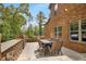 Brick patio with seating area and built-in grill at 105 Dockstreet Aly, Peachtree City, GA 30269