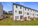 Newly constructed home with a backyard, including a grassy area, patio, and privacy fence at 3136 Washburn Se St, Atlanta, GA 30354