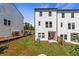 New home backyard with freshly laid grass, in a neighborhood under construction at 3136 Washburn Se St, Atlanta, GA 30354