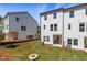 New construction townhouse boasts a manicured lawn and covered patio space for outdoor enjoyment at 3136 Washburn Se St, Atlanta, GA 30354