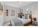 Well-lit bedroom with sports-themed decorations and a comfortable bed at 3136 Washburn Se St, Atlanta, GA 30354