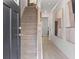 Welcoming entryway featuring a staircase with carpet runner and stylish decor at 3136 Washburn Se St, Atlanta, GA 30354