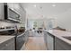 Modern kitchen with stainless appliances and open layout to the living area at 3136 Washburn Se St, Atlanta, GA 30354