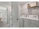 Functional laundry room featuring modern appliances and ample storage space at 3136 Washburn Se St, Atlanta, GA 30354