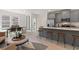Open-concept living space with a large island, modern stools, and hardwood flooring at 3136 Washburn Se St, Atlanta, GA 30354