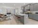Spacious open-concept kitchen and living area with a large center island and bar stool seating at 3136 Washburn Se St, Atlanta, GA 30354