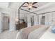 Spacious bedroom featuring a four-poster bed, walk-in closets, and a view of the outdoors at 3136 Washburn Se St, Atlanta, GA 30354