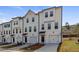 Charming townhomes with modern facades, private garages, and beautifully landscaped surroundings at 3136 Washburn Se St, Atlanta, GA 30354