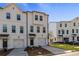 Charming townhomes with modern facades, private garages, and beautifully landscaped surroundings at 3136 Washburn Se St, Atlanta, GA 30354