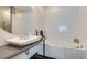 Stylish bathroom featuring a round mirror, sleek sink, and modern fixtures at 805 Peachtree Ne St # 401, Atlanta, GA 30308