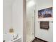 Bright bathroom with a glass-enclosed shower, tub, and decorative artwork at 805 Peachtree Ne St # 401, Atlanta, GA 30308