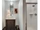 Chic bathroom featuring a vanity with a vessel sink and tiled shower at 805 Peachtree Ne St # 401, Atlanta, GA 30308