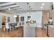Bright open kitchen with stainless steel appliances, granite countertops, and a view of the dining area at 805 Peachtree Ne St # 401, Atlanta, GA 30308
