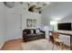 Comfortable living room with a sofa, desk, and unique ceiling design at 805 Peachtree Ne St # 401, Atlanta, GA 30308