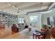Spacious living room with a cozy sofa, large windows and hardwood floors, perfect for relaxation at 805 Peachtree Ne St # 401, Atlanta, GA 30308