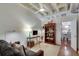 Cozy living room with a sofa, desk, and view into the dining area at 805 Peachtree Ne St # 401, Atlanta, GA 30308