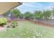 Landscaped backyard with trees, stone pathway and wooden fence at 3172 Trinity Grove Dr, Dacula, GA 30019