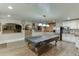 Spacious basement with pool table, kitchenette and game area at 3172 Trinity Grove Dr, Dacula, GA 30019