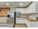 Basement kitchenette with stainless steel appliances at 3172 Trinity Grove Dr, Dacula, GA 30019