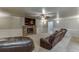 Finished basement with stone fireplace and TV at 3172 Trinity Grove Dr, Dacula, GA 30019