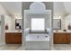 Luxurious bathroom with soaking tub and double vanities at 3172 Trinity Grove Dr, Dacula, GA 30019