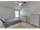 Cozy bedroom with dresser and ceiling fan at 3172 Trinity Grove Dr, Dacula, GA 30019