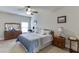 Spacious bedroom with carpeted floors and wooden furniture at 3172 Trinity Grove Dr, Dacula, GA 30019