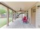 Relaxing covered patio with stamped concrete flooring, ceiling fan and comfortable seating at 3172 Trinity Grove Dr, Dacula, GA 30019