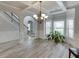 Bright dining room with hardwood floors and a chandelier at 3172 Trinity Grove Dr, Dacula, GA 30019