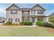 Two-story brick home with landscaped lawn and walkway at 3172 Trinity Grove Dr, Dacula, GA 30019