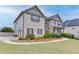 Two-story brick home with attached garage and landscaped yard at 3172 Trinity Grove Dr, Dacula, GA 30019