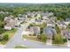 Aerial view of neighborhood with houses and green spaces at 3172 Trinity Grove Dr, Dacula, GA 30019