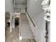 Elegant staircase with wood railings and neutral color palette at 3172 Trinity Grove Dr, Dacula, GA 30019