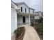 House entrance with a covered porch, walkway, and landscaping at 101 Natalie Ct, Dallas, GA 30157