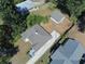 Aerial view showcasing a house, detached garage, and surrounding landscape at 1677 S Gordon Sw St, Atlanta, GA 30310