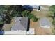 Aerial view showing a house, detached garage, and surrounding landscape at 1677 S Gordon Sw St, Atlanta, GA 30310
